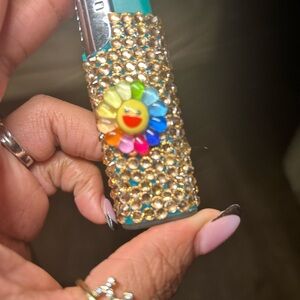 Decorative Teal Phone Accessory with Multicolor Flower Accent